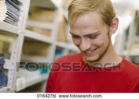 portrait of smiling male student in school library View Large Photo Image Stock Image - portrait of smiling male student in school library. Fotosearch