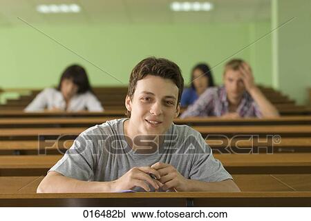 portrait of smiling male student in lecture hall View Large Photo Image Stock Image - portrait of smiling male student in lecture hall. Fotosearch