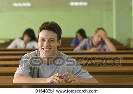 portrait of smiling male student in lecture hall View Large Photo Image Stock Image - portrait of smiling male student in lecture hall. Fotosearch