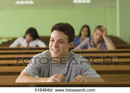 portrait of smiling male student in lecture hall View Large Photo Image Stock Image - portrait of smiling male student in lecture hall. Fotosearch