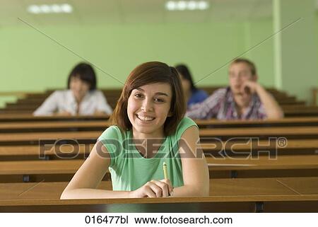 portrait of smiling young student in lecture hall View Large Photo Image Stock Image - portrait of smiling young student in lecture hall. Fotosearch
