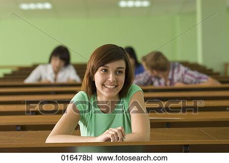 portrait of smiling young student in lecture hall View Large Photo Image Stock Image - portrait of smiling young student in lecture hall. Fotosearch