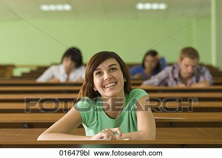 portrait of smiling young student in lecture hall View Large Photo Image Stock Image - portrait of smiling young student in lecture hall. Fotosearch