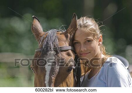 portrait of teenage girl with brown horse View Large Photo Image Stock Image - portrait of teenage girl with brown horse. Fotosearch