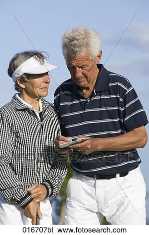 portrait of two mature golf players man making notes on scorecard View Large Photo Image Stock Image - portrait of two mature golf players man making notes on scorecard . Fotosearch