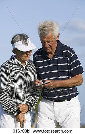 portrait of two mature golf players man making notes on scorecard View Large Photo Image Stock Image - portrait of two mature golf players man making notes on scorecard . Fotosearch