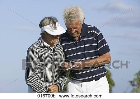 portrait of two mature golf players man making notes on scorecard View Large Photo Image Stock Image - portrait of two mature golf players man making notes on scorecard . Fotosearch