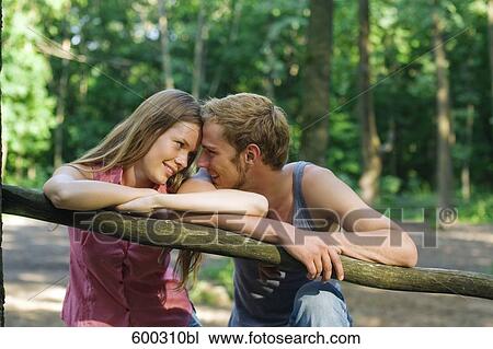 portrait of young couple tenderly looking at each other View Large Photo Image Stock Image - portrait of young couple tenderly looking at each other. Fotosearch