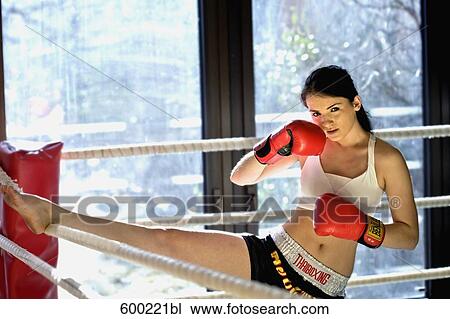 portrait of young female kickboxer stretching View Large Photo Image Stock Image - portrait of young female kickboxer stretching. Fotosearch