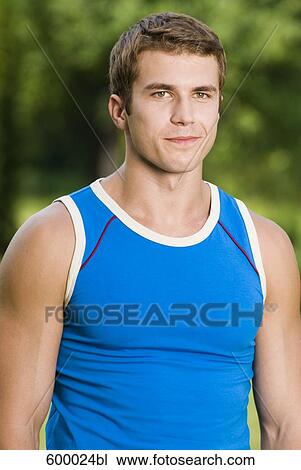 portrait of young man in blue sportswear View Large Photo Image Stock Image - portrait of young man in blue sportswear. Fotosearch