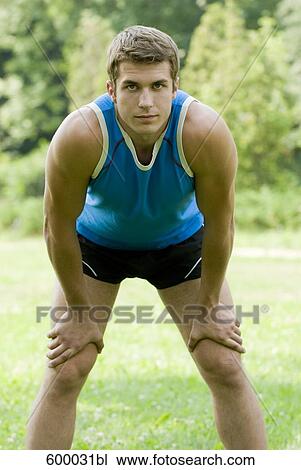 portrait of young man in blue sportswear View Large Photo Image Stock Image - portrait of young man in blue sportswear. Fotosearch