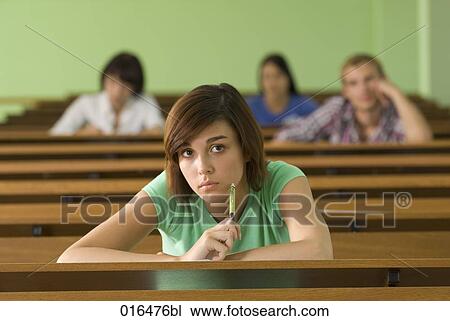 portrait of young student in lecture hall looking attentive View Large Photo Image Stock Image - portrait of young student in lecture hall looking attentive. Fotosearch