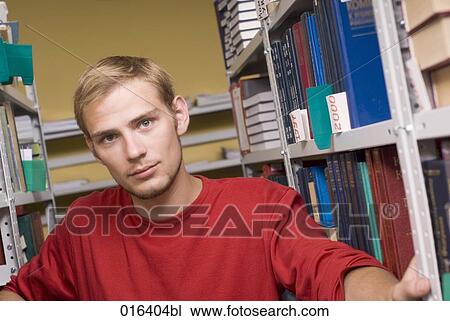 portrait of young student in school library View Large Photo Image Stock Image - portrait of young student in school library. Fotosearch