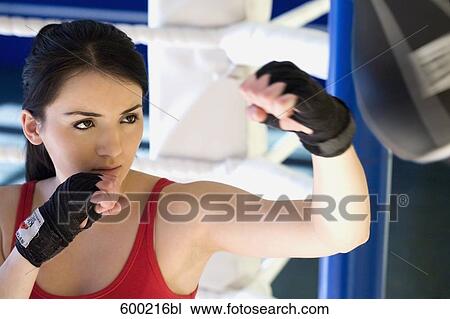portrait of young woman doing boxing training View Large Photo Image Stock Image - portrait of young woman doing boxing training. Fotosearch