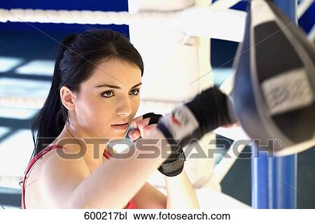 portrait of young woman doing boxing training View Large Photo Image Stock Image - portrait of young woman doing boxing training. Fotosearch