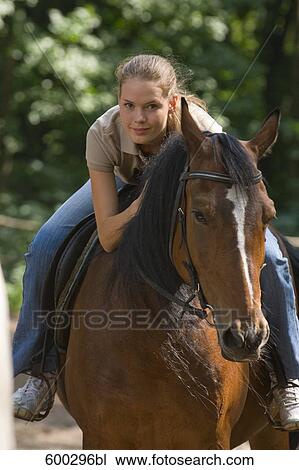 portrait of young woman on horse View Large Photo Image Stock Image - portrait of young woman on horse. Fotosearch