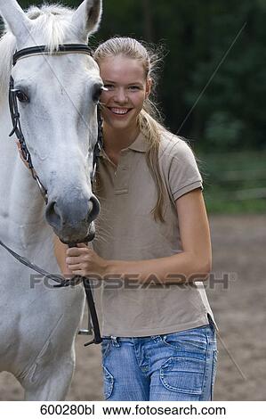 portrait of young woman with white horse View Large Photo Image Stock Image - portrait of young woman with white horse. Fotosearch