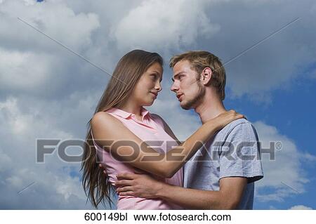 portriat of young couple tenderly looking at each other View Large Photo Image Stock Image - portriat of young couple tenderly looking at each other. Fotosearch