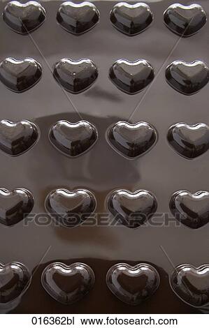rear view of cake pan in shape of hearts View Large Photo Image Stock Image - rear view of cake pan in shape of hearts. Fotosearch