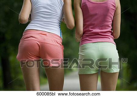 rear view of two young women in sportswear View Large Photo Image Stock Image - rear view of two young women in sportswear. Fotosearch