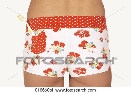 rear view of young woman wearing colourful underpants with toothbrush in pocket View Large Photo Image Stock Image - rear view of young woman wearing colourful underpants with toothbrush in pocket. Fotosearch