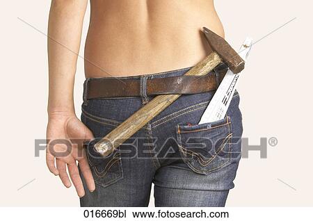 rear view of young woman with hammer and folding rule View Large Photo Image Stock Image - rear view of young woman with hammer and folding rule. Fotosearch