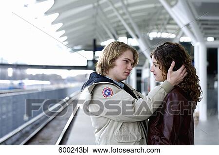 sad teenage couple embracing at station View Large Photo Image Stock Image - sad teenage couple embracing at station. Fotosearch