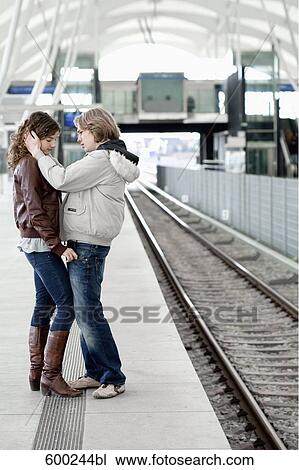 sad teenage couple embracing at station View Large Photo Image Stock Image - sad teenage couple embracing at station. Fotosearch