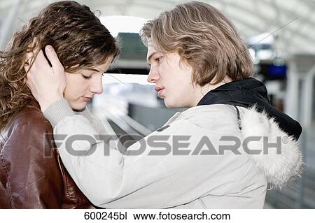 sad teenage couple embracing at station View Large Photo Image Stock Image - sad teenage couple embracing at station. Fotosearch