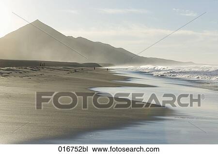 sandy beach at sunset View Large Photo Image Stock Image - sandy beach at sunset. Fotosearch