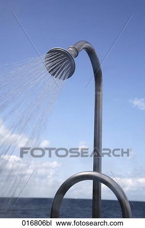 Stock Image - shower on beach splashing water. Fotosearch