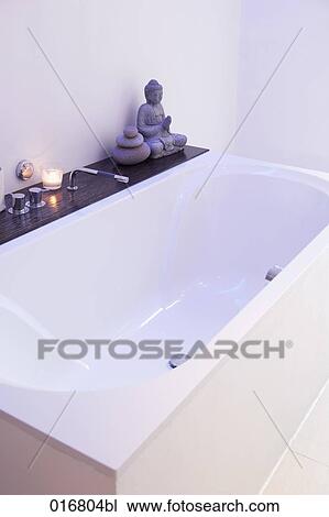 still life of bathtub with Buddha statue View Large Photo Image Stock Image - still life of bathtub with Buddha statue. Fotosearch
