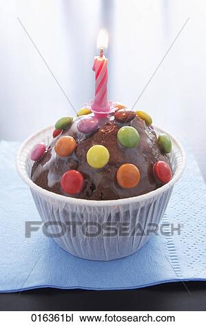 still life of chocolate muffin decorated with candle View Large Photo Image Stock Image - still life of chocolate muffin decorated with candle. Fotosearch