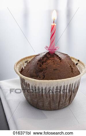 still life of chocolate muffin decorated with candle View Large Photo Image Stock Image - still life of chocolate muffin decorated with candle. Fotosearch
