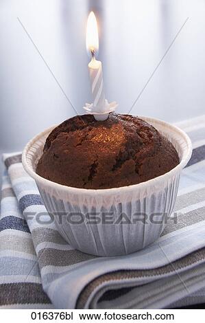 still life of chocolate muffin decorated with candle View Large Photo Image Stock Image - still life of chocolate muffin decorated with candle. Fotosearch