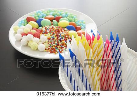 still life of colourful candles and candies on a plate View Large Photo Image Stock Image - still life of colourful candles and candies on a plate. Fotosearch
