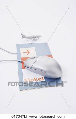 Stock Image - still life of computer mouse air ticket and toy airplane. Fotosearch