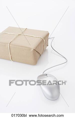 Stock Image - still life of computer mouse and package. Fotosearch