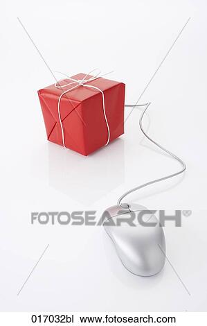 Stock Image - still life of computer mouse and present. Fotosearch