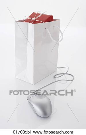 still life of computer mouse and present in shopping bag View Large Photo Image Stock Image - still life of computer mouse and present in shopping bag. Fotosearch