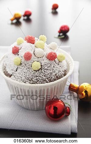 still life of muffin decorated with icing sugar and baubles View Large Photo Image Stock Image - still life of muffin decorated with icing sugar and baubles. Fotosearch