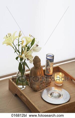 still life of tray with flowers cnadles and Buddha statue View Large Photo Image Stock Image - still life of tray with flowers cnadles and Buddha statue. Fotosearch