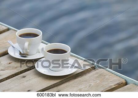 still life of two coffee cups on wooden pier View Large Photo Image Stock Image - still life of two coffee cups on wooden pier. Fotosearch