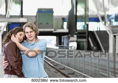 teenage couple embracing each other at underground station View Large Photo Image Stock Image - teenage couple embracing each other at underground station. Fotosearch