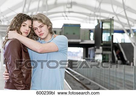 teenage couple embracing each other at underground station View Large Photo Image Stock Image - teenage couple embracing each other at underground station. Fotosearch