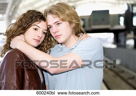 teenage couple embracing each other at underground station View Large Photo Image Stock Image - teenage couple embracing each other at underground station. Fotosearch
