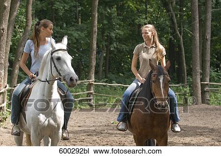 two female friends on horses View Large Photo Image Stock Image - two female friends on horses. Fotosearch