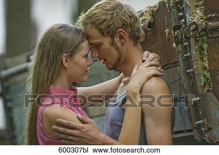 young couple tenderly looking at each other View Large Photo Image Stock Image - young couple tenderly looking at each other. Fotosearch