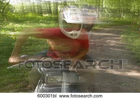 young man and girlfriend driving on quad through forest View Large Photo Image Stock Image - young man and girlfriend driving on quad through forest. Fotosearch