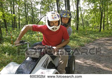 young man and girlfriend driving on quad through forest View Large Photo Image Stock Image - young man and girlfriend driving on quad through forest. Fotosearch